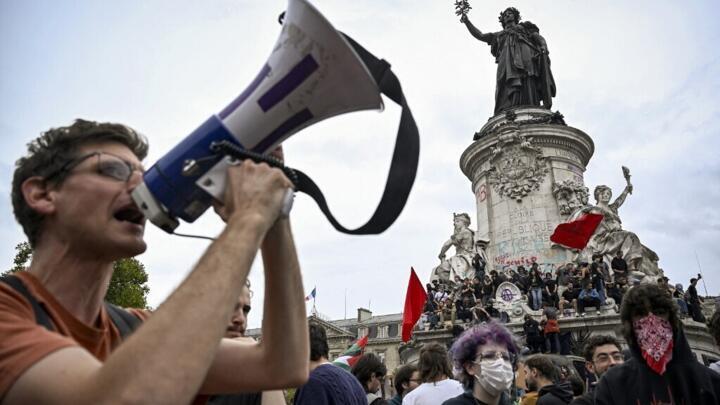 A person uses a megaphone during a demonstration at the Place de la Republique square, in Paris, on September 10, 2025.
