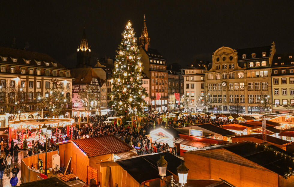 People stroll at a Christmas market in Strasbourg, eastern France, in November 2025.