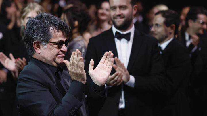 Director Jafar Panahi, Palme d'Or award winner for the film "Un simple accident" (It Was Just an Accident), applauds during the closing ceremony of the 78th Cannes Film Festival in Cannes, France, May