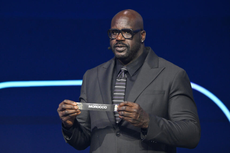 Former NBA player Shaquille O'Neal holds up Morocco after drawing from a pot during the draw for the 2026 soccer World Cup at the Kennedy Center in Washington.