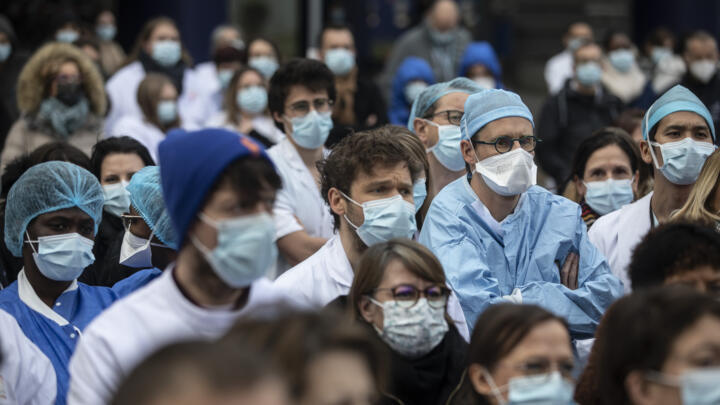 Medical staff observe a minute of silence outside Strasbourg University Hospital in eastern France in January 2022.