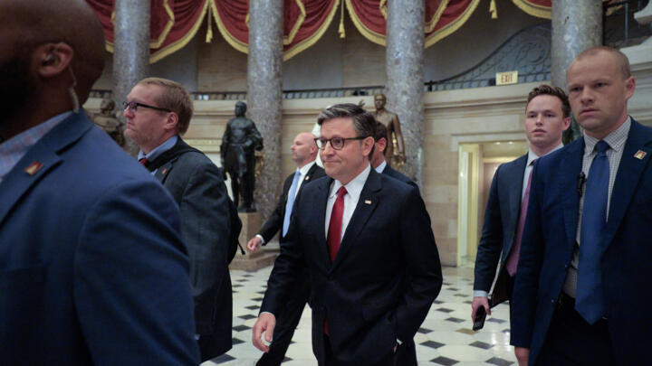 Speaker of the House Mike Johnson (R-LA) is surrounded by security and staff as he heads to a procedural vote on the One Big Beautiful Bill Act in the U.S. Capitol on July 02, 2025.