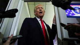 US President Donald Trump speaks to reporters aboard Air Force One during travel on November 25, 2025.