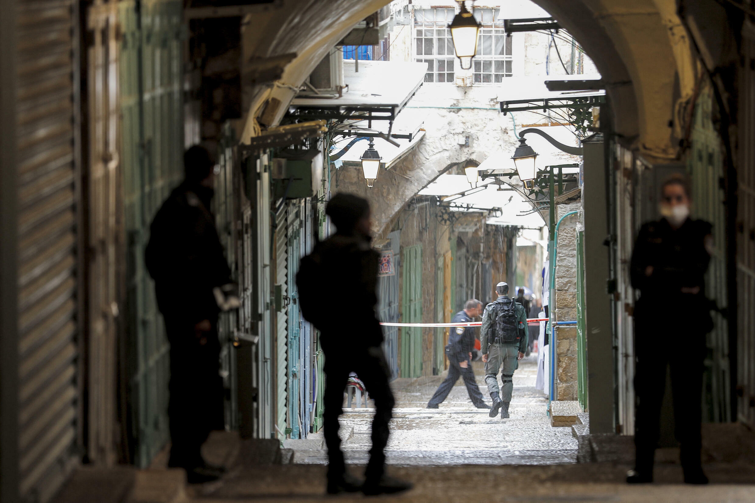 Israeli security forces gather at the scene of a shooting in the old city of Jerusalem on November 21