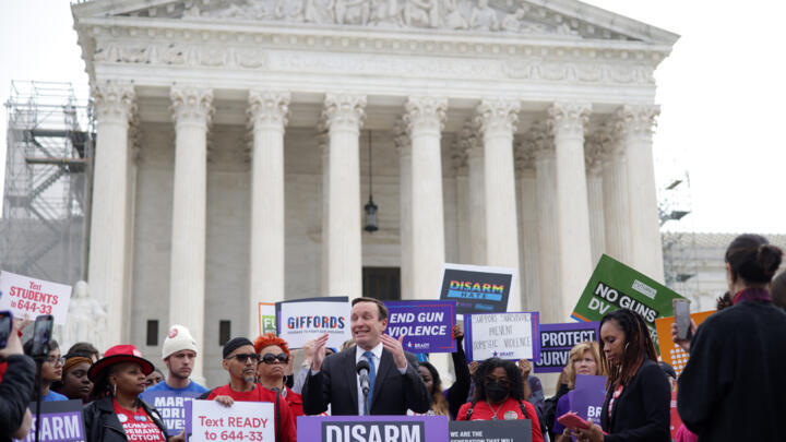 US Senator Chris Murphy speaks outside the Supreme Court as the justices weigh whether persons subject to a domestic violence restraining order should be prohibited from possessing a firearm