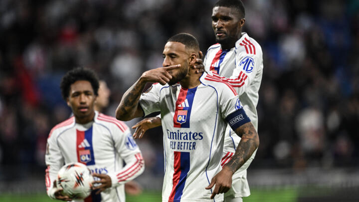 Lyon's French midfielder #08 Corentin Tolisso (C) celebrates with teammates after scoring his team's first goal during the UEFA Europa League 1st round.