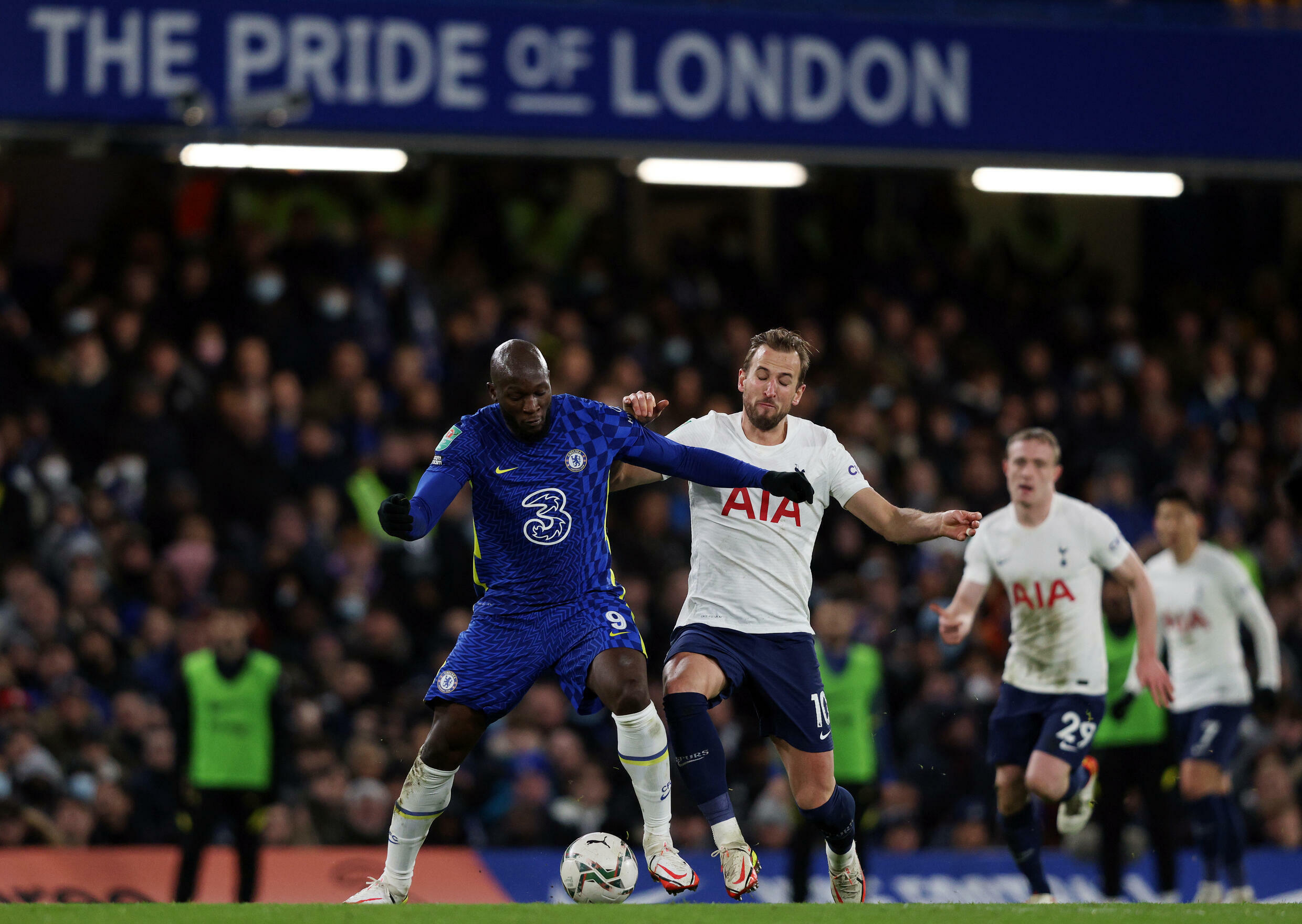 Chelsea strikers Romelu Lukaku (L) and Tottenham Harry Kane fight in the first leg of the FA Cup semi-final in London on January 5, 2022.