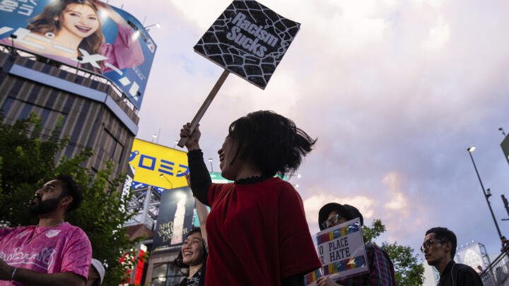 Demonstrators take part in a 'protest rave' against racism and nationalist party Sanseito ahead of the upper house election in the Shinkuku district of Tokyo on July 13, 2025.