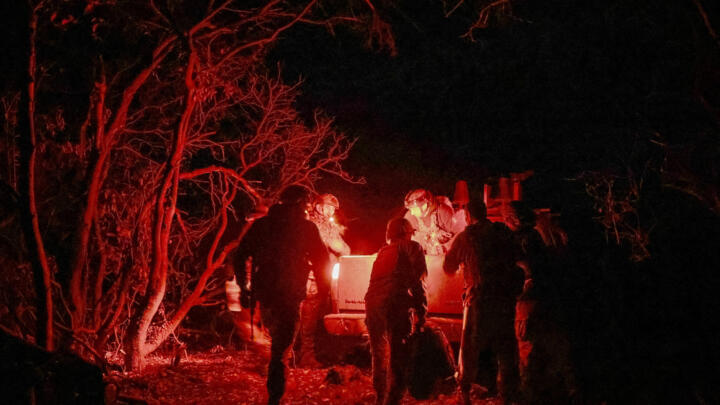 Artillerymen of the 152nd Separate Jaeger Brigade get into a car after a combat mission near the front-line town of Pokrovsk in the Donetsk region of Ukraine on October 15, 2025.