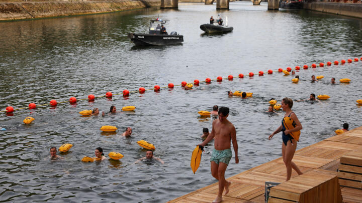 People swim in the River Seine in Paris on July 5 2025, in the first public bathing session in the capital's historic waterway since 1923.