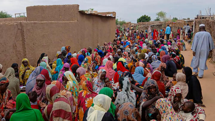 File photo of Sudanese civilians gathered to receive aid in El Fasher in Sudan's Darfur region taken August 11, 2025.