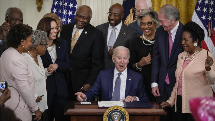 US President Joe Biden signs the Juneteenth National Independence Day Act into law in the East Room of the White House on June 17, 2021 in Washington, DC.