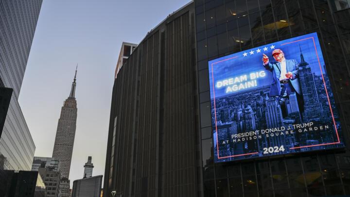 An illuminated sign announcing the arrival of Donald Trump at Madison Square Garden, October 27, 2024, in New York.