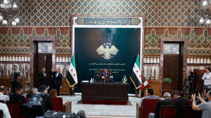 The Spokesman for the Supreme Committee for the Syrian parliamentary elections, Nawwar Nejmeh, announces the final results of Syria's first parliamentary elections since the ouster of former President Bashar Assad during a press conference in Damascus, Syria, Monday, October 6, 2025.
