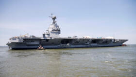 Pre-Commissioning Unit Gerald R. Ford (CVN 78) is maneuvered by tugboats in the James River during the aircraft carrier's turn ship evolution in Newport News, Virginia, US on June 11, 2016.