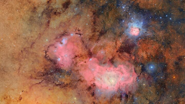 The Trifid Nebula and the Lagoon Nebula -- stellar nurseries within our Milky Way -- are seen in unprecedented detail