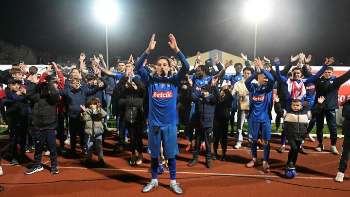 Avranches’ French midfielder #9 Nassim Sabihi (C) celebrates his team's victory at the end of the Coupe de France round of 64 football match between Avranches and Brest.