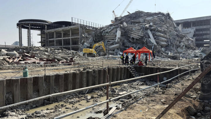 Rescuers work at the site a collapsed high-rise building after an earthquake in Bangkok, Thailand, March 28, 2025.