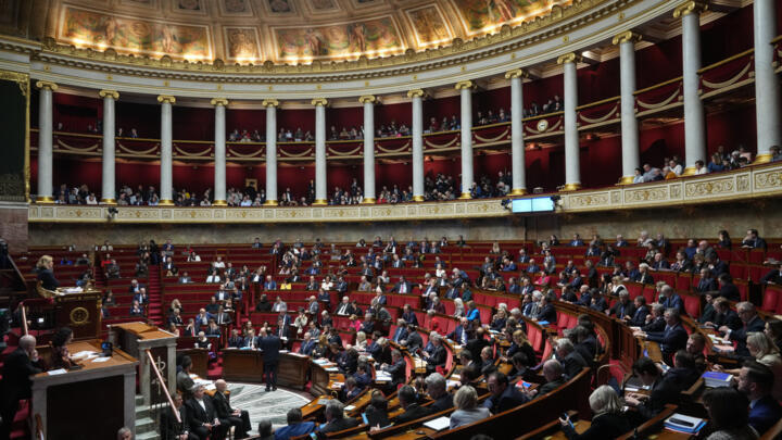 Parliament members in France's National Assembly vote on a national health care budget on December 9, 2025.