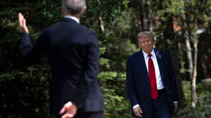 Canadian Prime Minister Mark Carney (L) greets US President Donald Trump at the Group of Seven (G7) Summit,Canada on June 16, 2025.