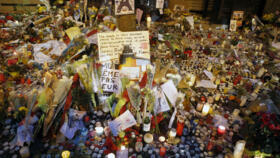 Flowers, pictures and candles are set in memory outside La Belle Equipe restaurant in Paris, one of the locations attacked, November 17, 2015.