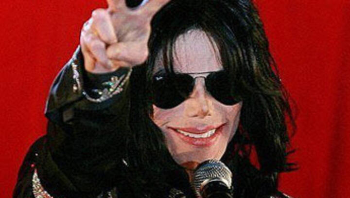 Record bids expected in auction for Warhol's Jackson portrait