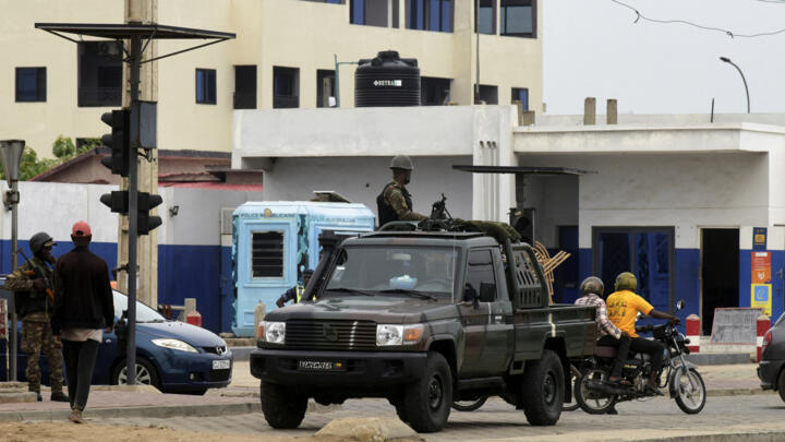 A military vehicle patrols a street in Cotonou, Benin, on December 8, 2025, a day after the country's armed forces thwarted an attempted coup.