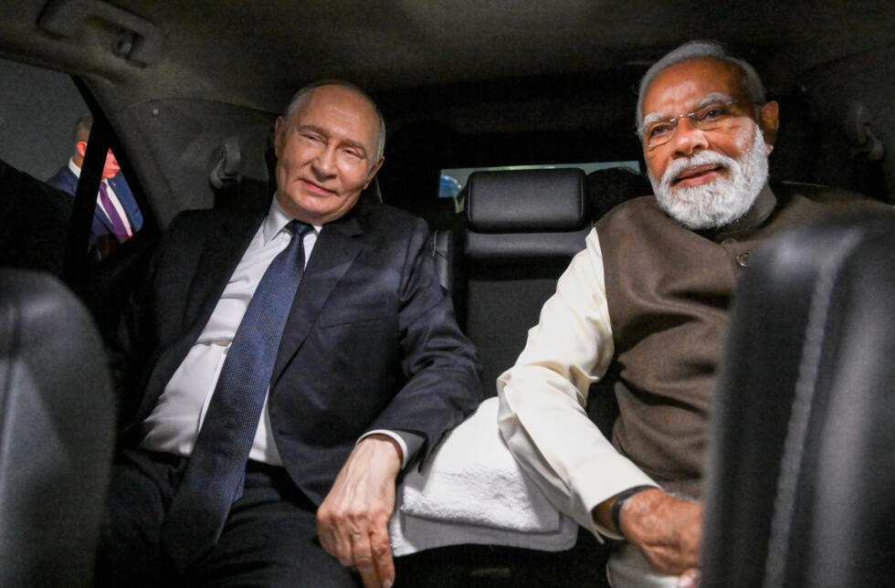 Vladimir Putin and Narendra Modi sitting in a limousine at Palam Air Base in New Delhi.