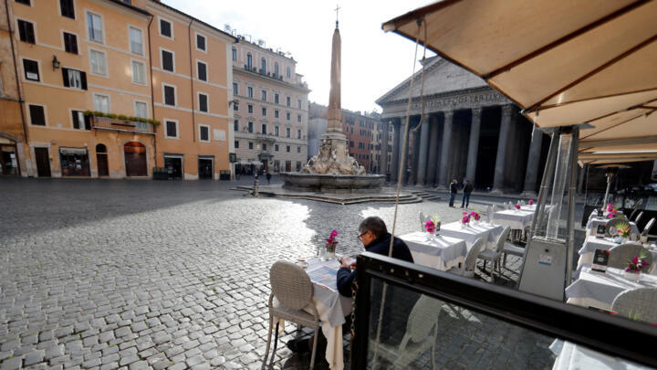 A customer seated at a cafe facing the Pantheon in Rome on February 1, 2021.