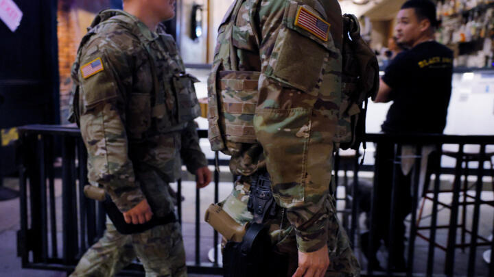 Members of the Ohio National Guard wear their sidearms while patrolling the Logan Circle neighborhood, weeks after US President Donald Trump ordered National Guard and law enforcement to patrol the