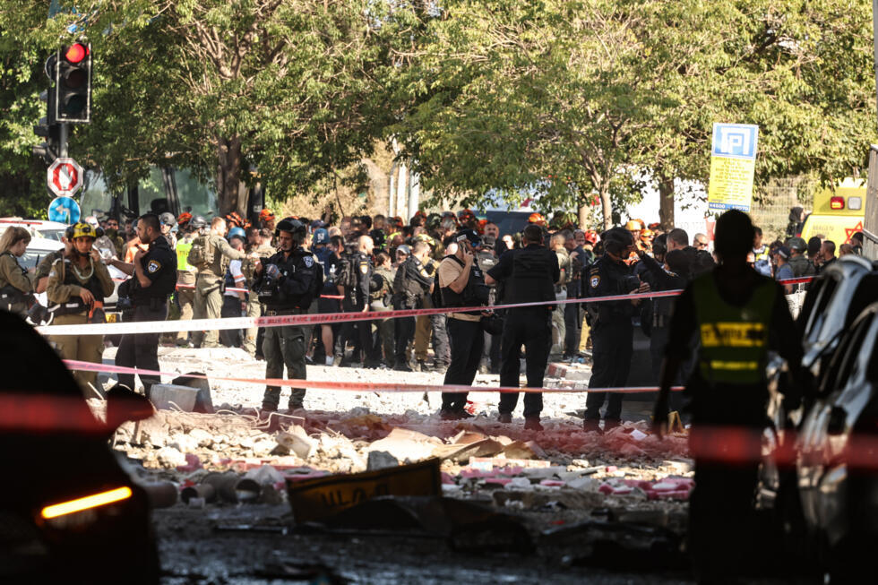 Israeli forces cordon off an area  in the coastal city of Haifa after Iranian missile fire.