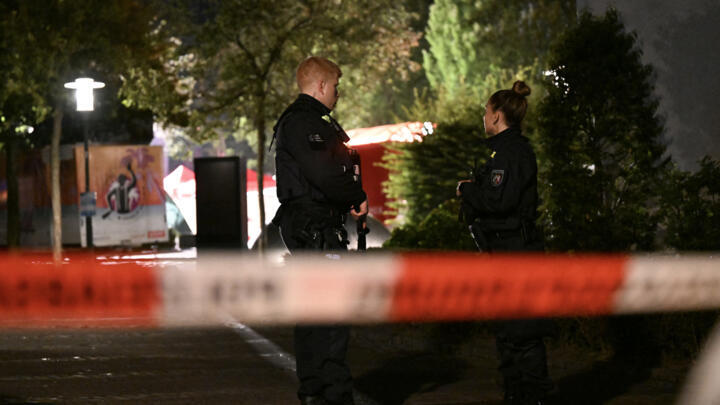 Police officers early August 24, 2024, secure the scene of a knife attack in Solingen, Germany.
