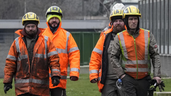 Steel workers walk to the main factory of struggling steel producer Thyssenkrupp.