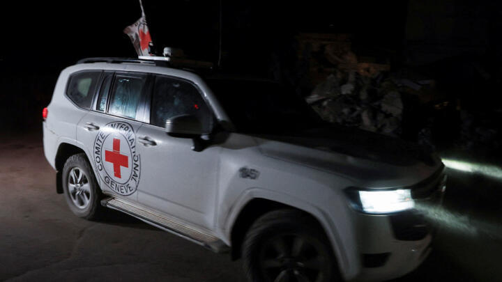 A Red Cross vehicle transports the bodies of hostages who were held in Gaza since the deadly attack on 7 October 2023, after they were handed over by Hamas militants as part of a ceasefire and hostage