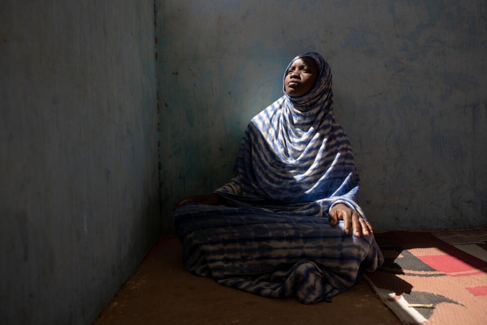 Moyme, who fled Mali in fear of the Malian Army and its Russian allies, poses for a portrait in the Mbera camp, Mauritania, where she found refuge, Nov. 4, 2025.