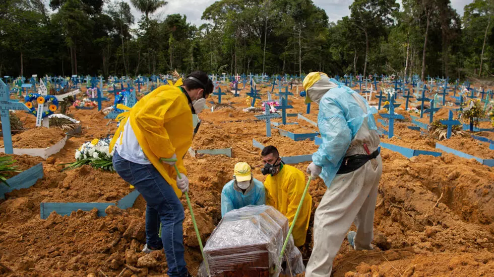 A burial takes place in an area reserved for COVID-19 victims at the Nossa Senhora Aparecida cemetery in Manaus, Brazil, on January 5, 2021