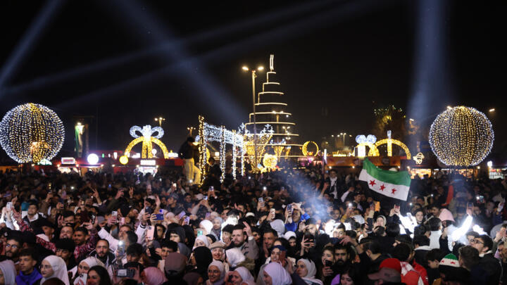 People celebrate the New Year near Umayyad Square in Damascus, Syria. 