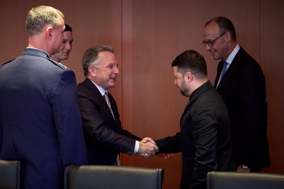 Ukraine's President Volodymyr Zelensky greets US special envoy Steve Witkoff as German Chancellor Friedrich Merz and Jared Kushner, the son-in-law of President Donald Trump, look on