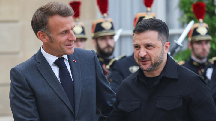 France's President Emmanuel Macron shakes hands with Ukraine's President Volodymyr Zelensky, ahead of a meeting at the Élysée Presidential Palace in Paris on September 3, 2025. 