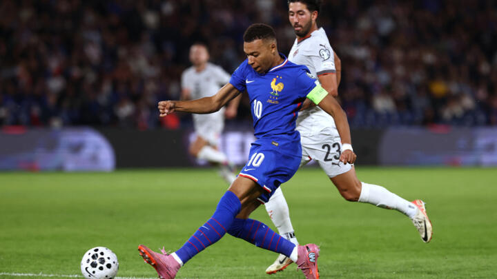 France's Kylian Mbappe fights for the ball with Iceland's Mikael Egill Ellertsson during the FIFA World Cup 2026 football match at the Parc des Princes stadium in Paris, on September 9, 2025.