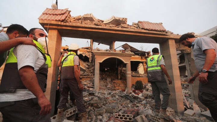 File photo of civil defence members searching the rubble of a building destroyed by an Israeli strike in the village of Teir Debba in southern Lebanon taken on November 6, 2025.