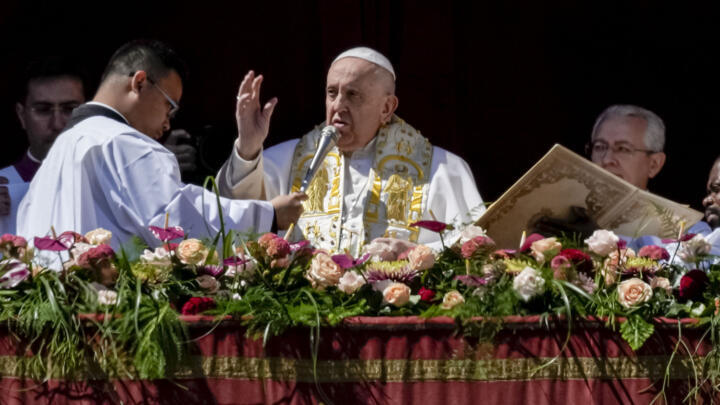 Pope Francis bestows the plenary 'Urbi et Orbi' (to the city and to the world) blessing from the central lodge of the St. Peter's Basilica at the Vatican at the end of the Easter Sunday Mass, on April 9, 2023