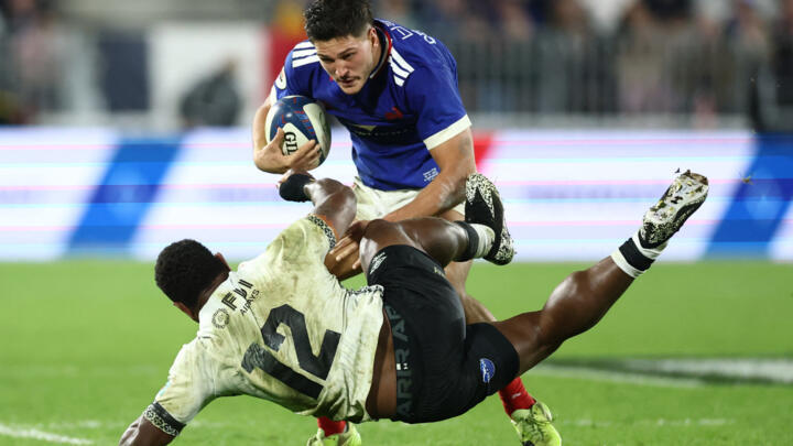 France's Nicolas Depoortère in action with Fiji's Josua Tuisova.
