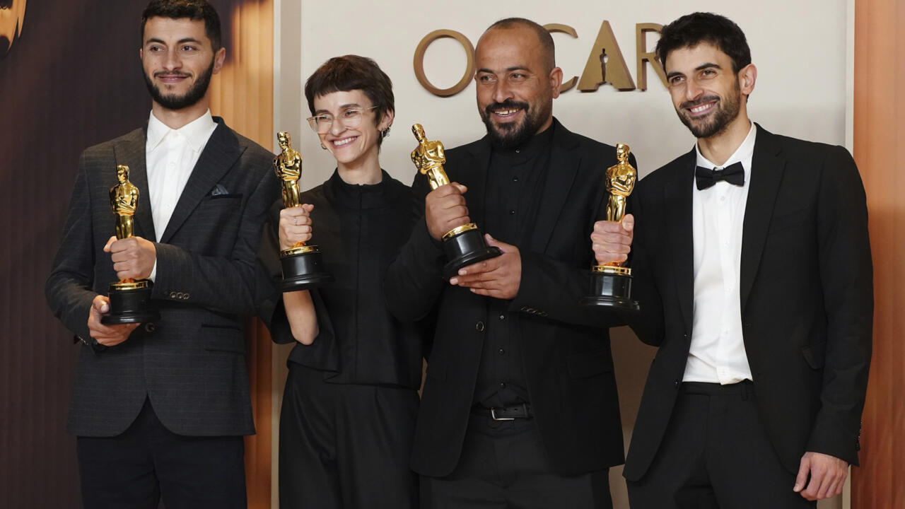 Hamdan Ballal, second from right, with co-directors Basel Adra, Rachel Szor and Yuval Abraham in Los Angeles after winning the Oscar for best documentary feature film for "No Other Land", March 2 2025