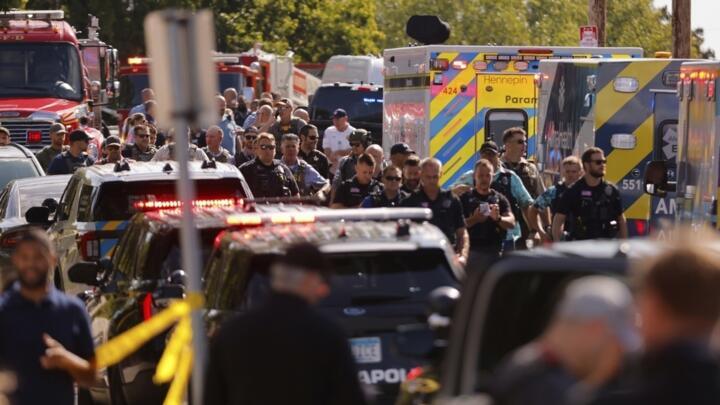 Law enforcement officers gather outside the Annunciation Church's school in response to a reported mass shooting, Wednesday, Aug. 27, 2025, in Minneapolis.