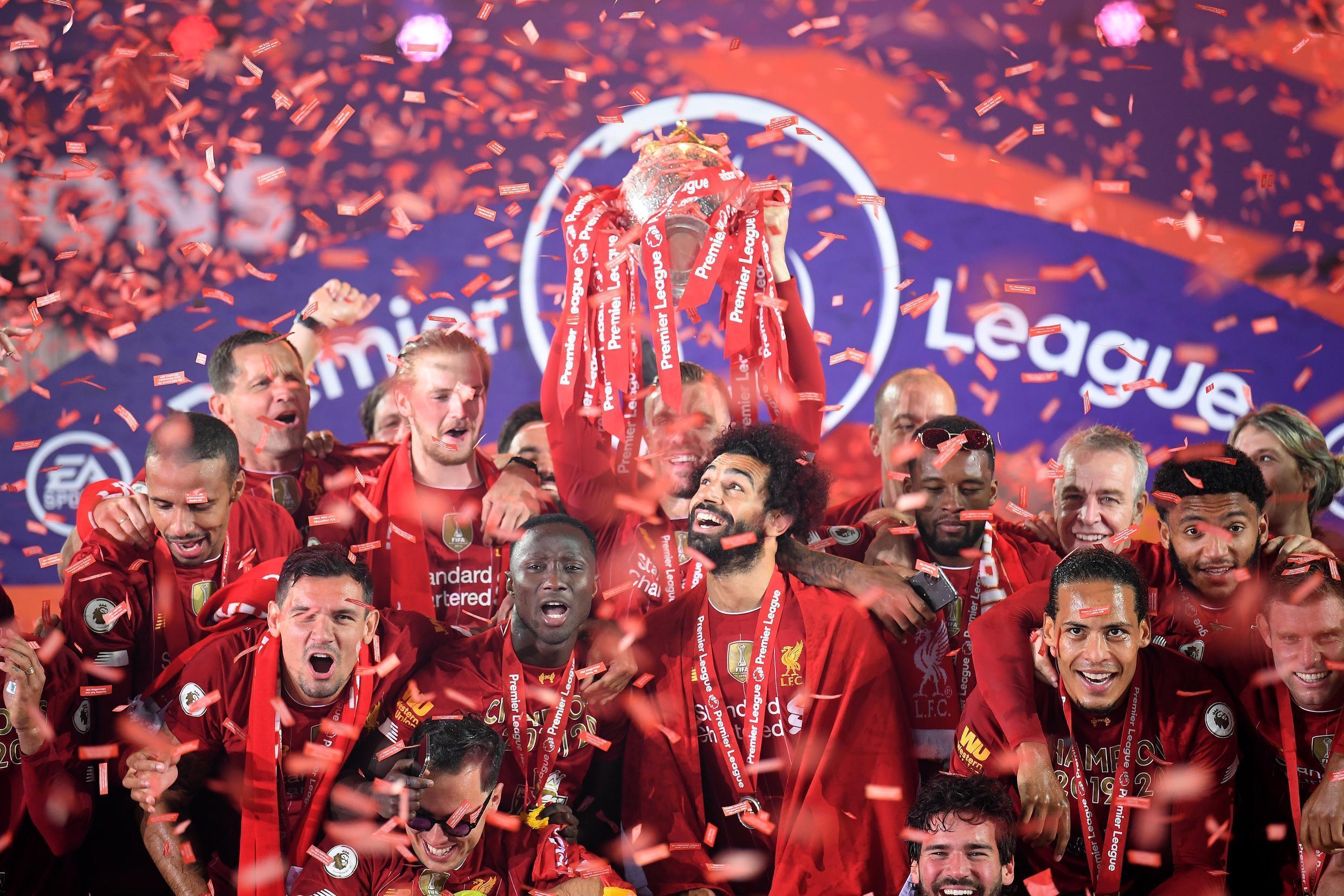 Liverpool celebrate their record 19th championship victory, the first of the Premier League era.