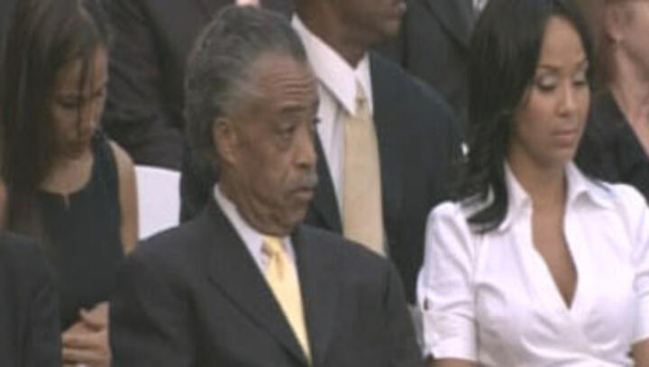 Mourners pay last respects as pop legend is buried