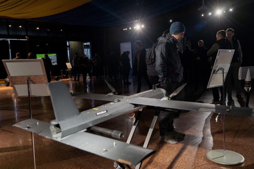 Visitors get acquainted with the latest Ukrainian drones at an exhibition in Kyiv, on December 2, 2024, amid the Russian invasion of Ukraine.