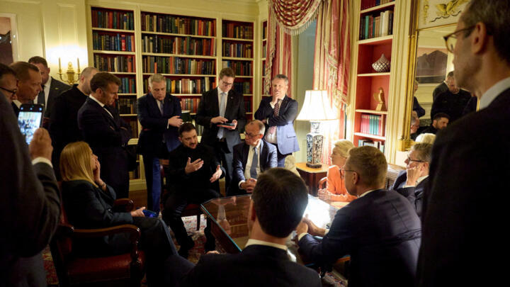 Ukrainian President Volodymyr Zelenskiy speaks with French President Emmanuel Macron, German Chancellor Friedrich Merz, Britain's Prime Minister Keir Starmer, European Commission's President Ursula vo