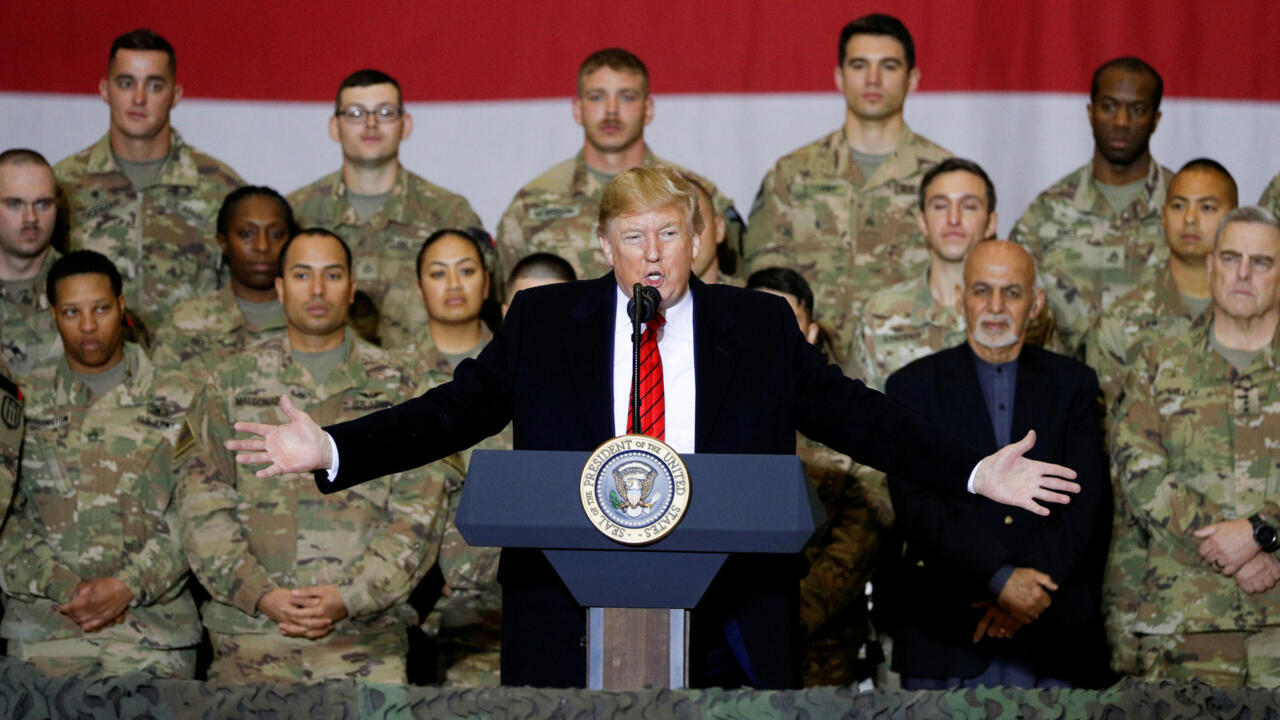 Trump says Taliban talks back on during visit with troops in Afghanistan